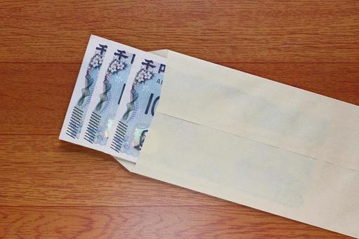 茶封筒に入れた千円札 茶封筒に入れた千円札 茶封筒,封筒,クラフト封筒の写真素材