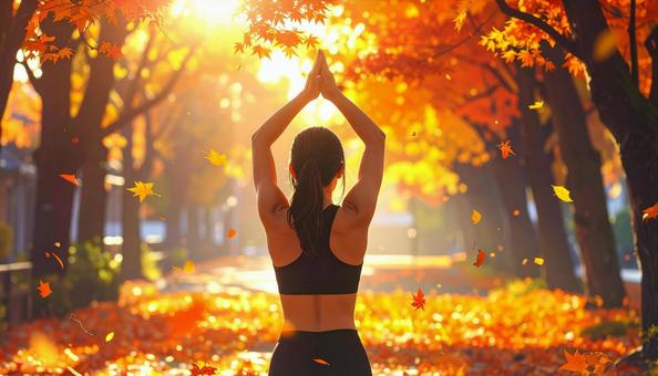 スポーツの秋 紅葉の中でストレッチ 女性 スポーツの秋 紅葉の中でストレッチ 女性の写真