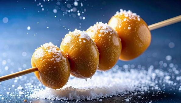 串に刺した銀杏の実の写真