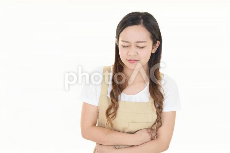 腹痛を訴える主婦 女性,主婦,病気の写真素材