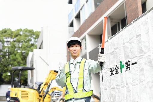 Traffic controller pumping his fist at a construction site, JPG Traffic controller pumping his fist at a construction site, JPG