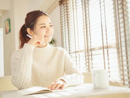 Image of a woman taking notes in a notebook, telework, female, note, JPG