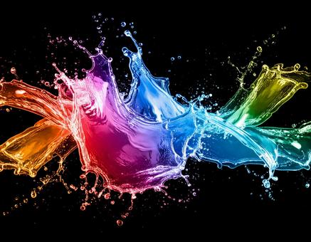 弾ける虹色の水の写真