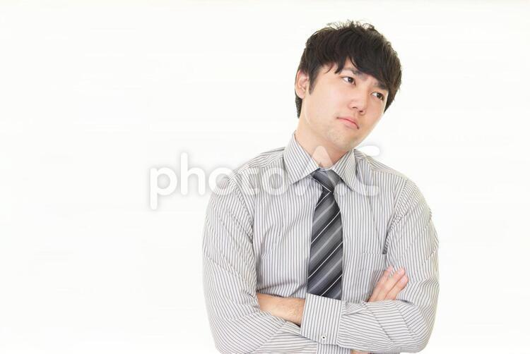 疲れた表情のビジネスマン 男性,ビジネスマン,男の写真素材