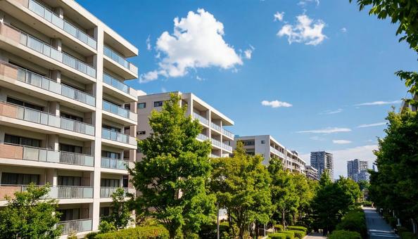 高層マンションを見上げる 青空背景 高層マンションを見上げる 青空背景の写真