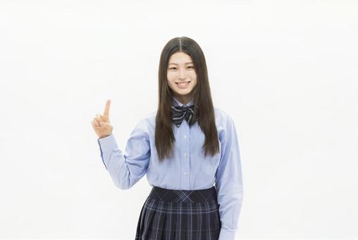指差しをする女子高生 指差しをする女子高生 女性,高校生,人物の写真素材