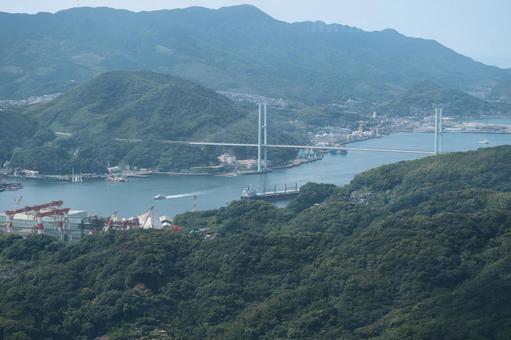 山並みと海にかかる白い橋 山,山並み,海の写真素材