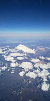 上空から見る冠雪富士と宇宙空間 上空から見る冠雪富士と宇宙空間 富士山,冠雪,宇宙空間の写真素材