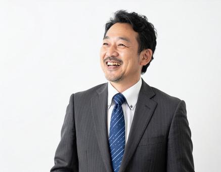 笑うビジネスマン 笑うビジネスマンの写真