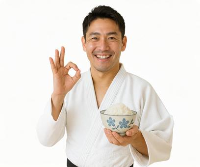 花柄茶碗で笑顔の柔道選手のオッケーポーズ 花柄茶碗で笑顔の柔道選手のオッケーポーズの写真