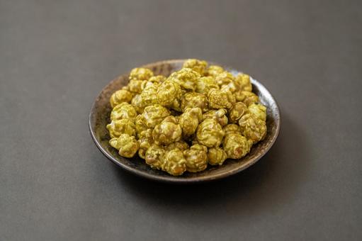 Matcha popcorn on a simple black background, JPG