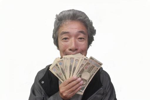 一万円の札束を持って喜ぶシニア男性 シニア,シニア男性,老人の写真素材