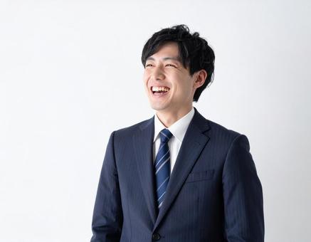 笑うビジネスマン 笑うビジネスマンの写真