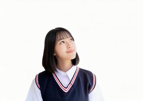 斜め上を見る女子高生 斜め上を見る女子高生の写真