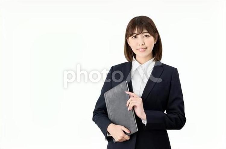 白背景でタブレットを持つビジネスウーマン 女性,ビジネスウーマン,タブレットの写真素材