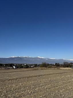 12月の田んぼと北アルプス 冬,winter,12月の写真素材