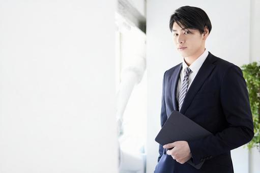 Japanese male businessman looking at the camera with a serious expression, business, male, businessman, JPG