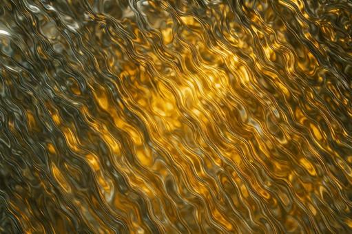 黄金に輝く液体金属のテクスチャ 黄金に輝く液体金属のテクスチャの写真