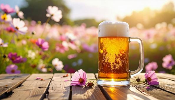 生ビールとコスモスの写真