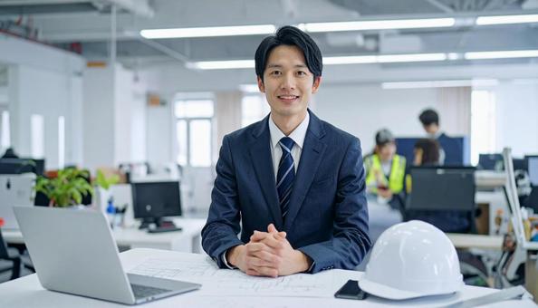 事務所で働く新入社員ビジネスマンの写真