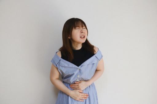 お腹を お腹,腹痛,トイレの写真素材
