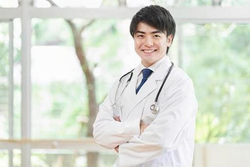 Male doctor working in a hospital, un uomo, un medico, un medico, JPG