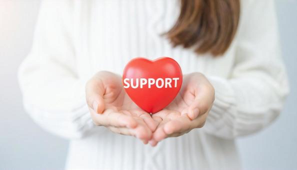 女性の手に浮かぶハート「SUPPORT」 女性の手に浮かぶハート「SUPPORT」の写真