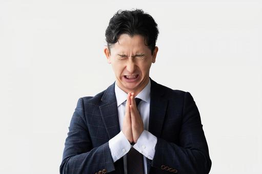 お願い・謝るポーズの男性ビジネスマン お願い・謝るポーズの男性ビジネスマン 男性,ビジネス,ビジネスマンの写真素材