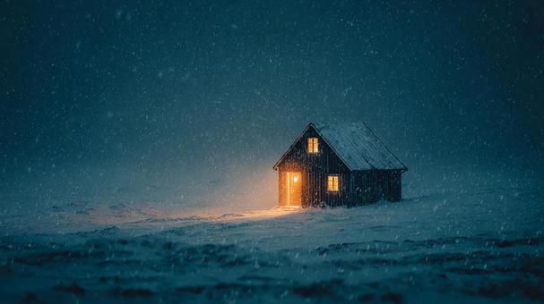 雪が降る小屋の温かい光 雪が降る小屋の温かい光の写真