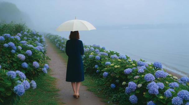 川辺に咲くアジサイを見る女性 川辺に咲くアジサイを見る女性の写真