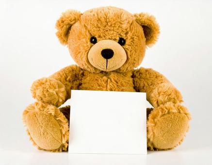 メッセージカードを持ったテディベア メッセージカードを持ったテディベアの写真