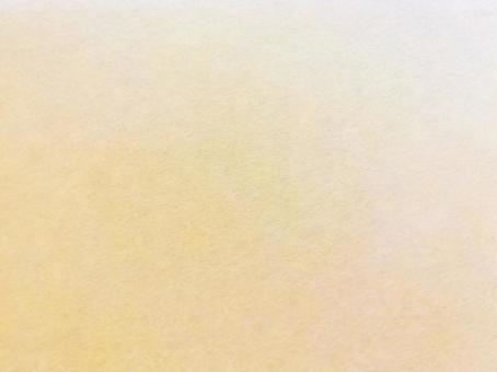 和紙　ざらざらした薄橙色のグラデーションの写真