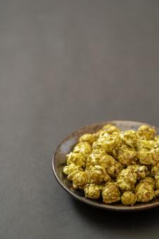 Matcha popcorn on a simple black background, JPG