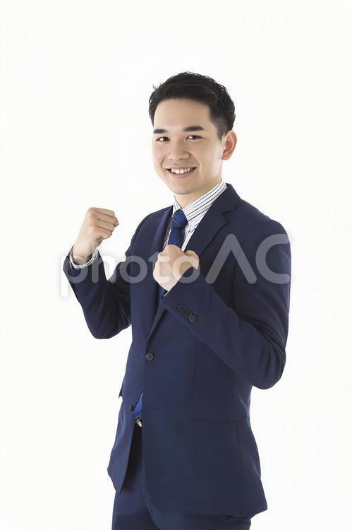 ガッツポーズで喜びを表現する若き日本人 ビジネスマン,男性,日本人の写真素材