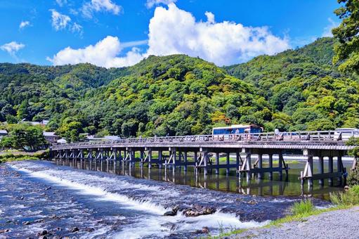 嵐山の渡月橋とバスと青空 嵐山の渡月橋とバスと青空 嵐山,渡月橋,青空の写真素材