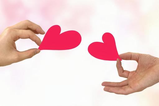 愛や共感を交換する二人の手とハート 愛や共感を交換する二人の手とハート 告白,2人,共感の写真素材