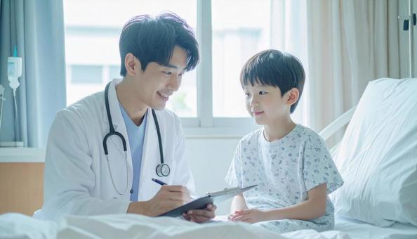 子供の患者と問診する医師 子供の患者と問診する医師の写真