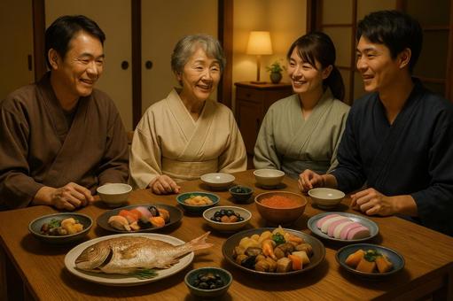 お祝い料理を囲む家族 お祝い料理を囲む家族の写真