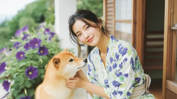 朝顔柄の浴衣を着た女性と柴犬と朝顔 朝顔柄の浴衣を着た女性と柴犬と朝顔の写真