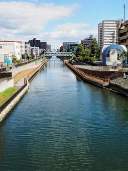 初秋のクローバー橋から見る街並み・江東区 初秋のクローバー橋から見る街並み・江東区 初秋,小名木川,クローバー橋の写真素材