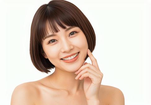 頬に指をあて微笑むショートボブの若い女性 頬に指をあて微笑むショートボブの若い女性の写真