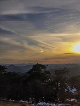 Snowy hills melting in the evening glow, JPG