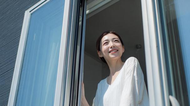 Smiling woman opening the window on a refreshing morning, morning, window, sunny, JPG