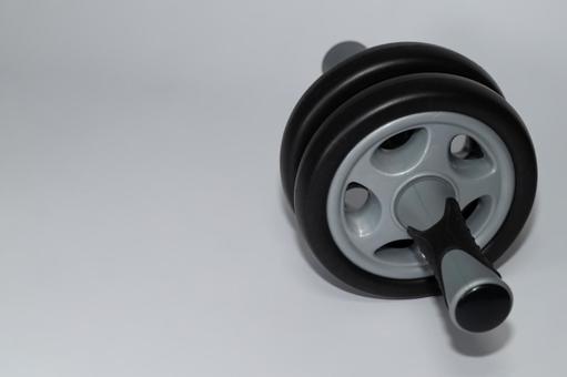 腹筋ローラーとコピースペース 腹筋ローラー,アブローラー,筋トレの写真素材