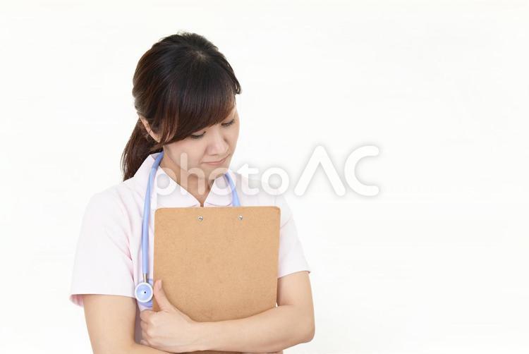 疲れた様子の看護師 女性,看護師,看護士の写真素材