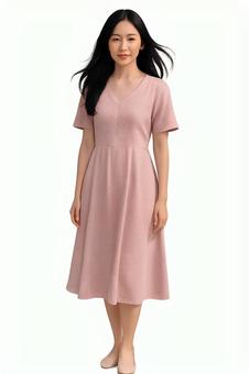 春ファッション女性ピンクワンピース白背景の写真