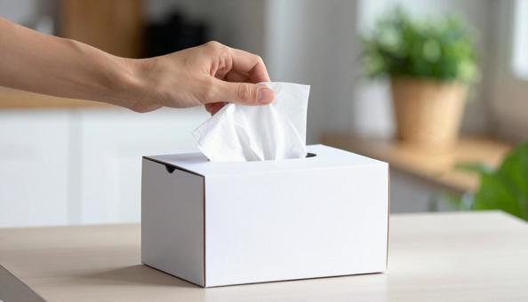 ティッシュペーパーを掴む手 ティッシュペーパーを掴む手の写真