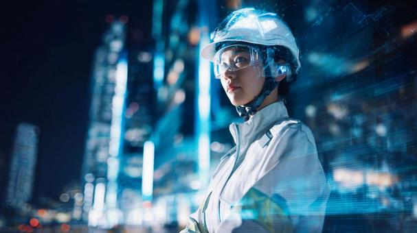 未来都市と女性技術者 未来都市と女性技術者の写真