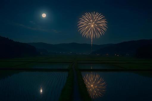田園に映る月夜花火の写真