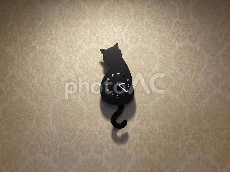 黒猫の時計 猫の素材,背景,壁紙の写真素材